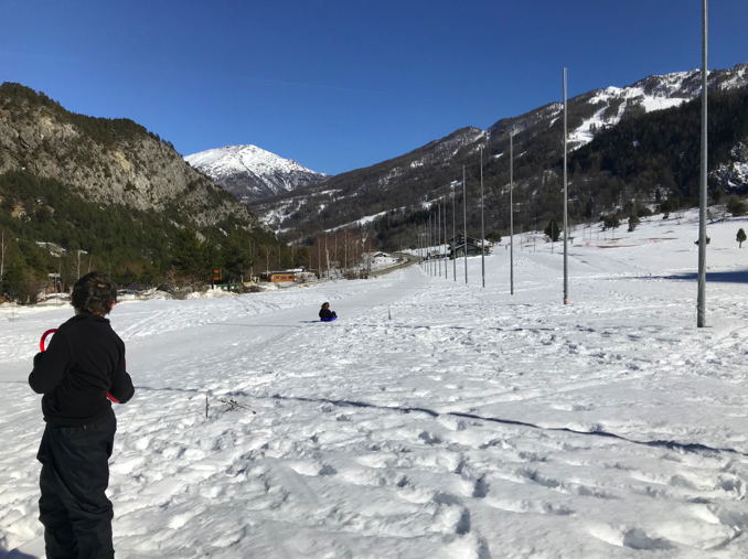 image shows Davide sledging in the snow