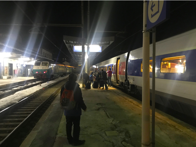 image shows Davide waiting on the platform while the train loads