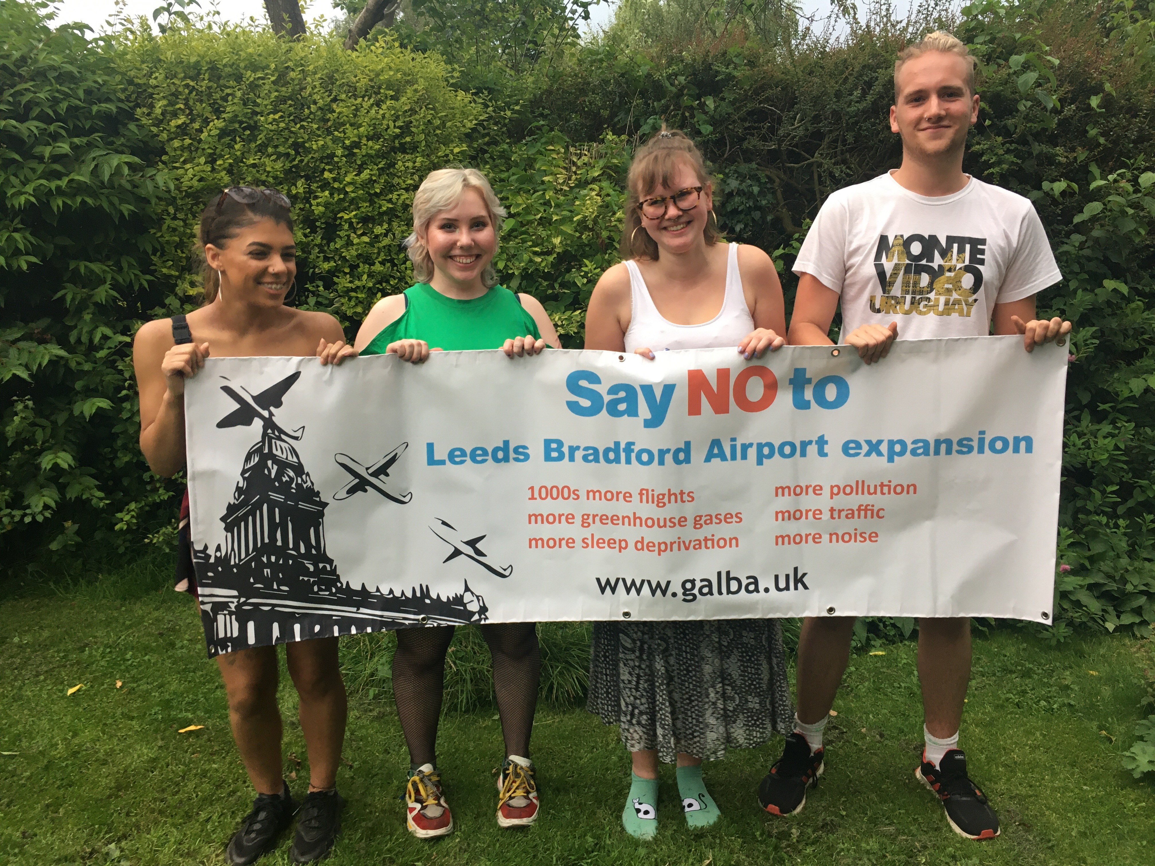 Four teenagers hold a sign saying "No to Leeds Bradford expansion"